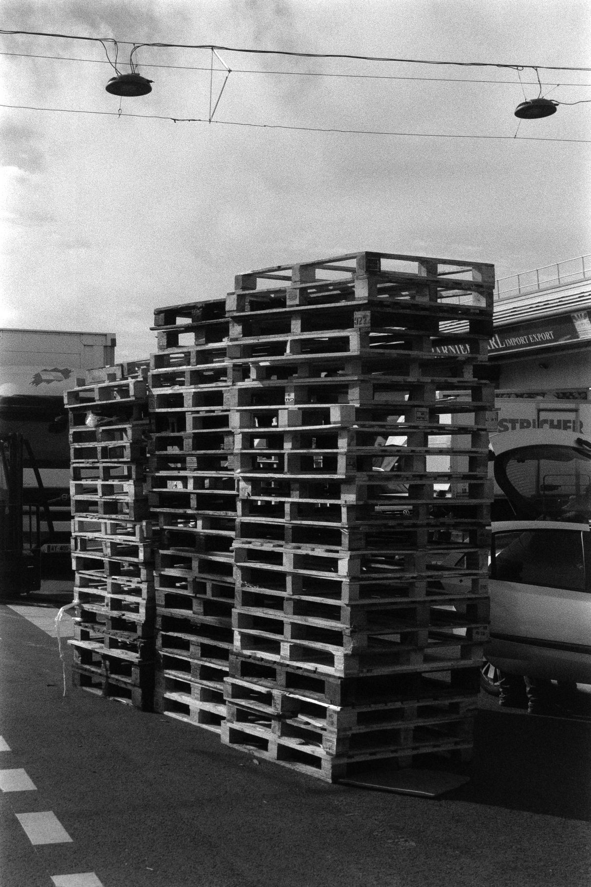 Stacked used wooden pallets